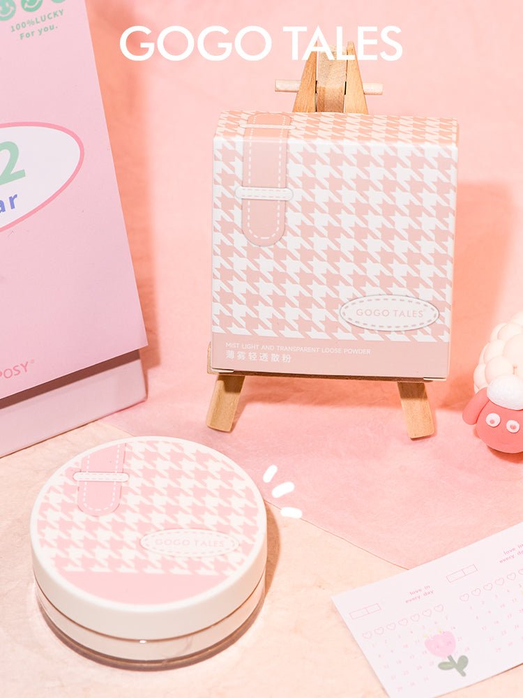 Close-up of GOGOTALES Setting Loose Powder packaging, featuring a pink and white checkered design.